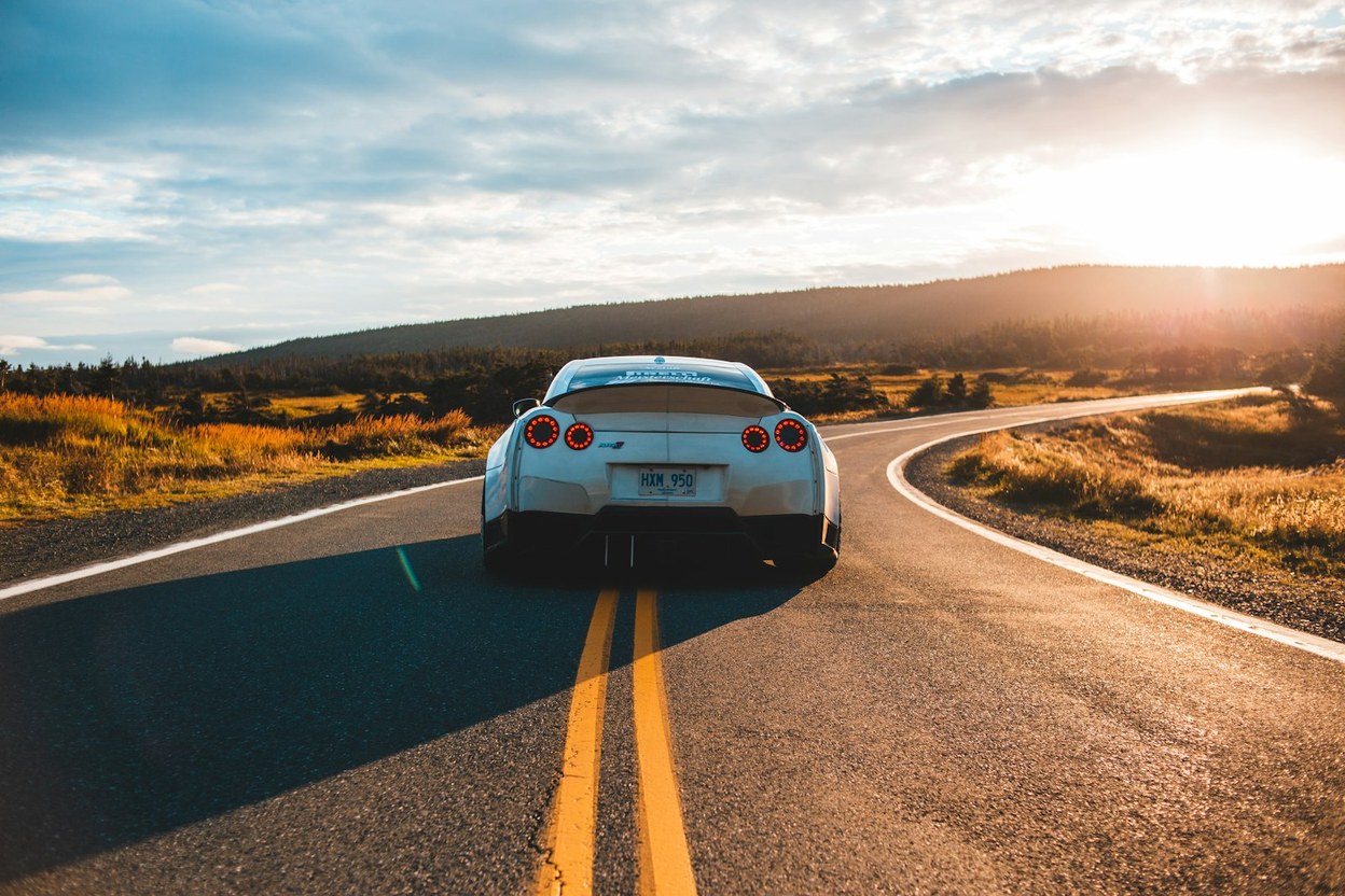 A silver car parked outdoors — register a vehicle new to you or new to the state.